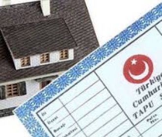 TAŞINMAZ MALLARIN KDV DURUMUNDAKİ İSTİSNA SÜRESİNİN TESPİTİ